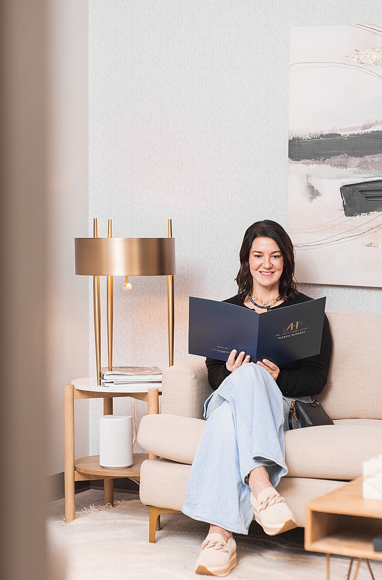 Woman reading on a sofa in modern decor.