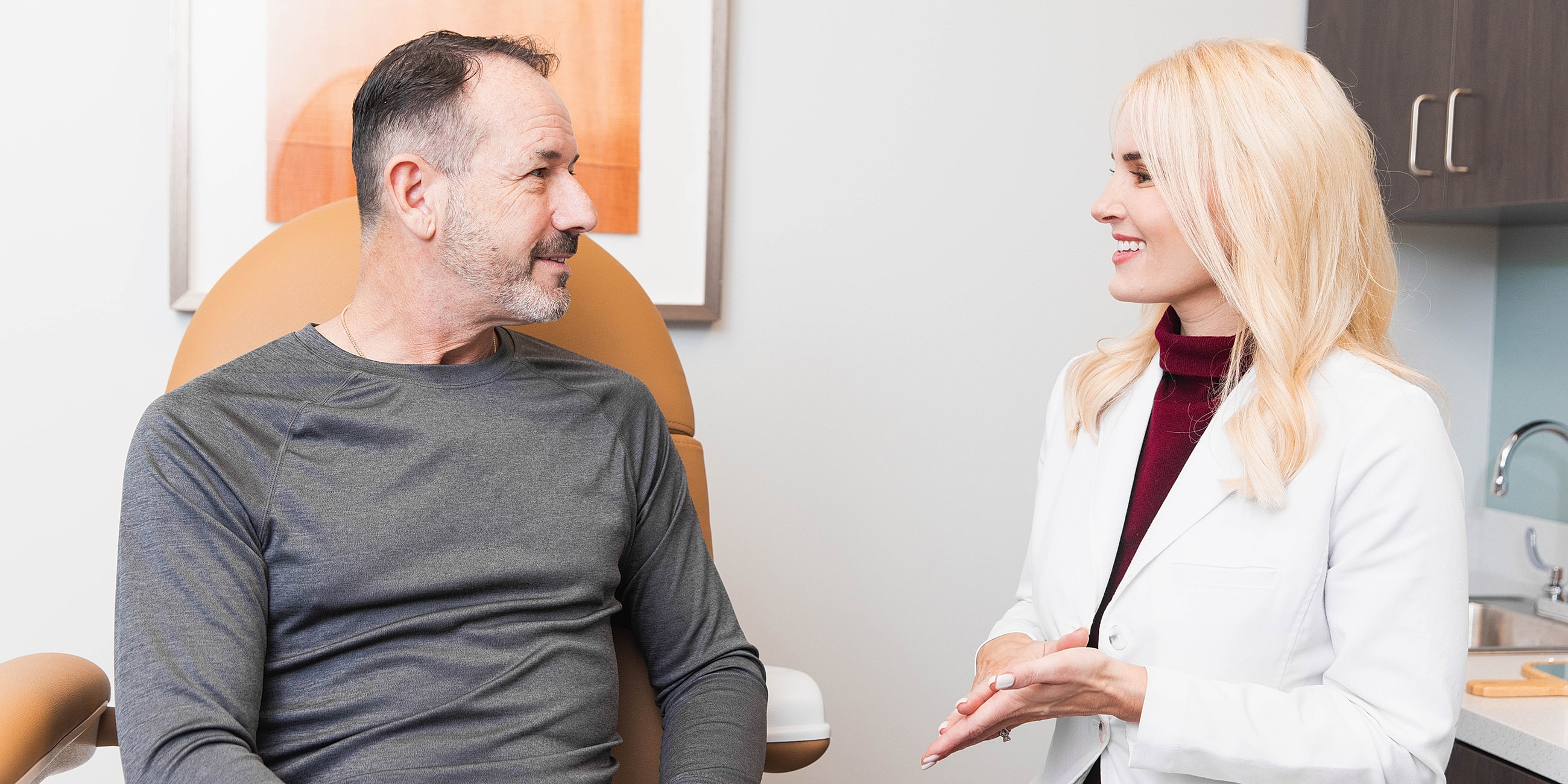 Patient consultation with medical professional in clinic.