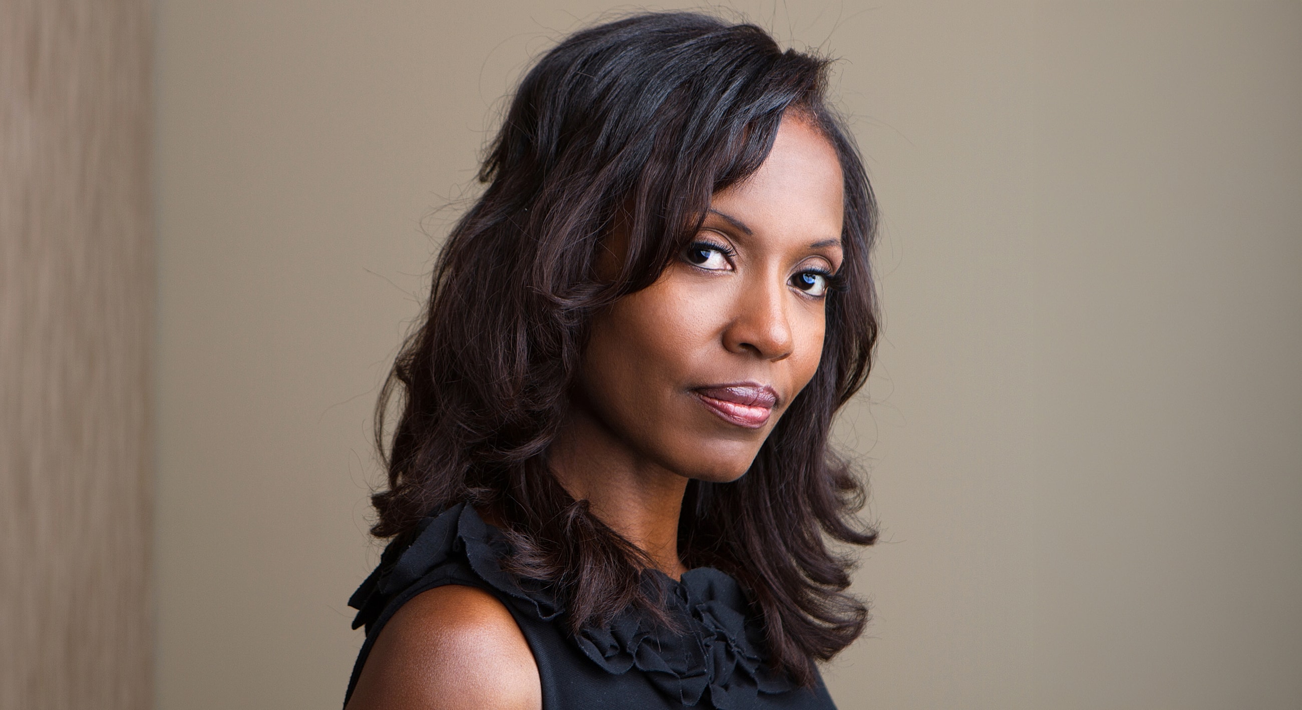 Portrait of a woman with long, dark hair.