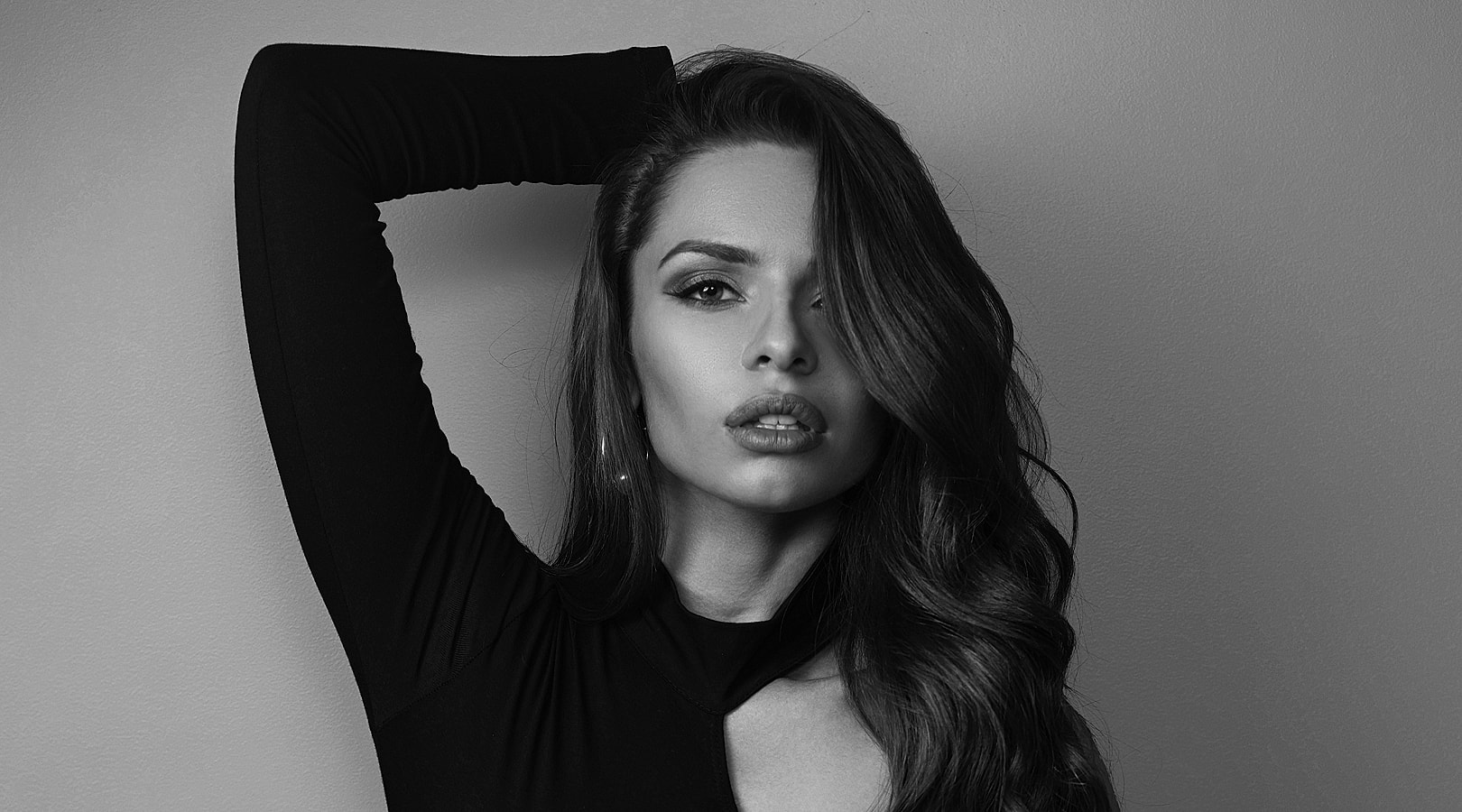 Black and white portrait of a confident woman.